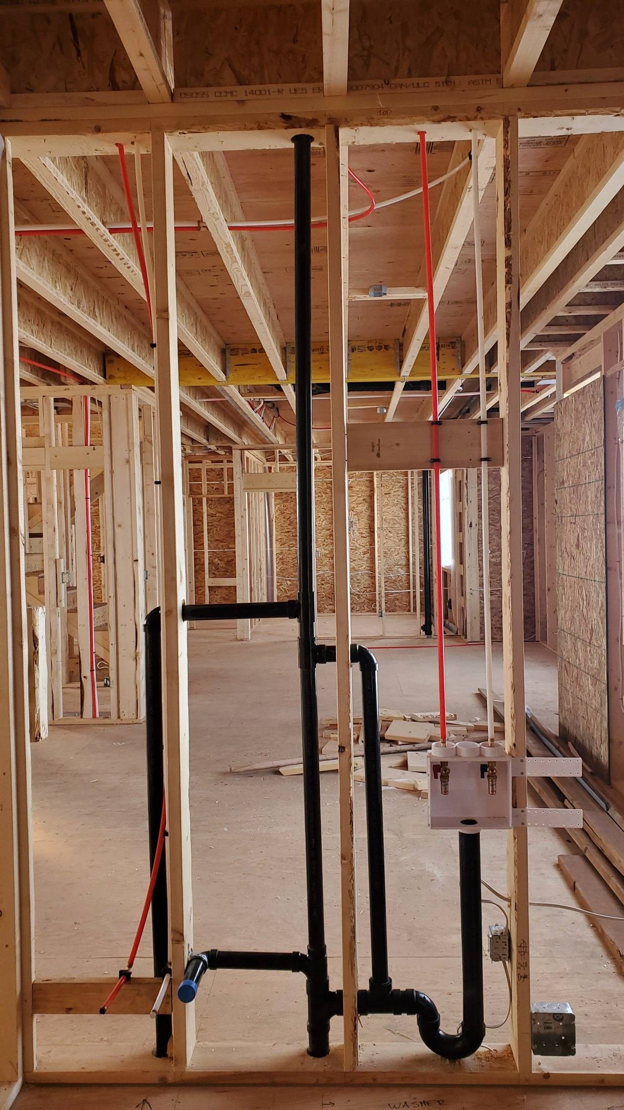 Basement plumbing rough-in by Flow Forge Mechanical in a Calgary home
