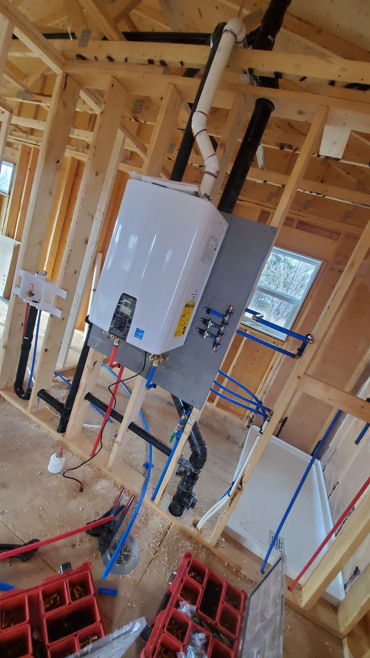 Tank vs tankless water heater comparison for Calgary homes by Flow Forge Mechanical
