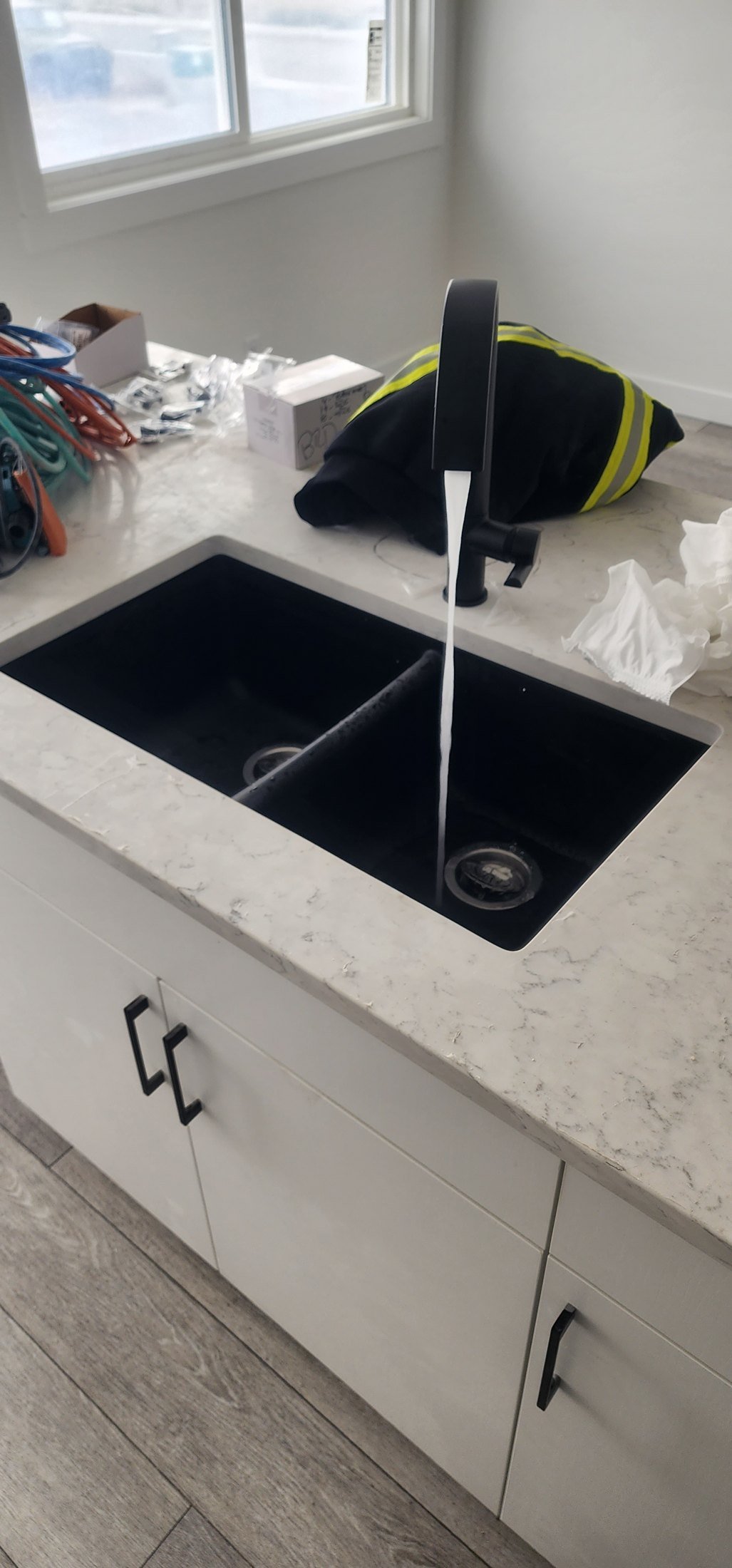 Kitchen plumbing installation in a Calgary home by Flow Forge Mechanical