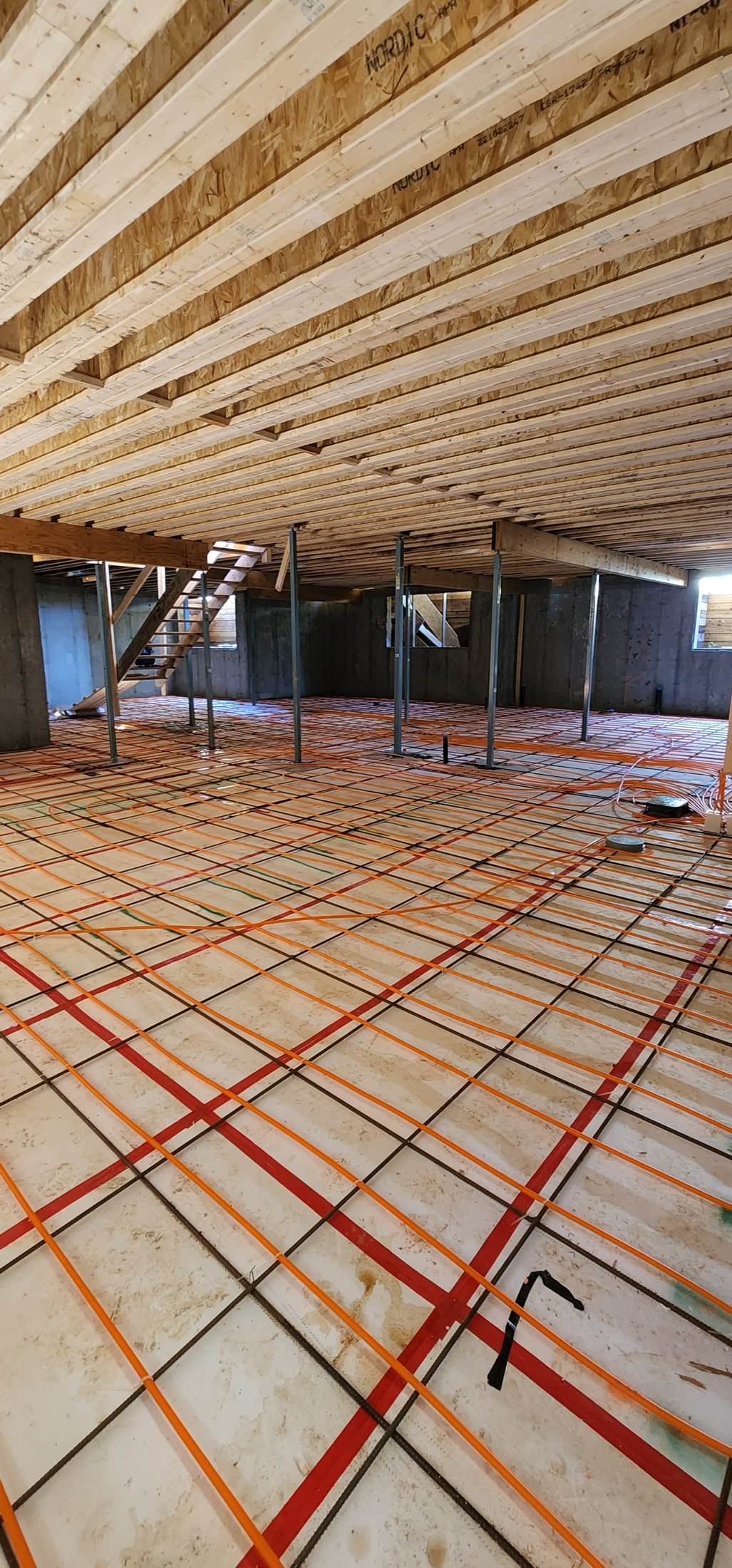 In-floor radiant heating tubing installed by Flow Forge Mechanical in Calgary
