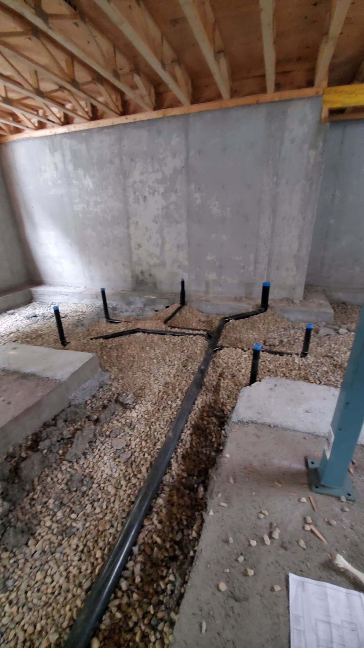 Secondary suite plumbing rough-in in a Calgary basement by Flow Forge